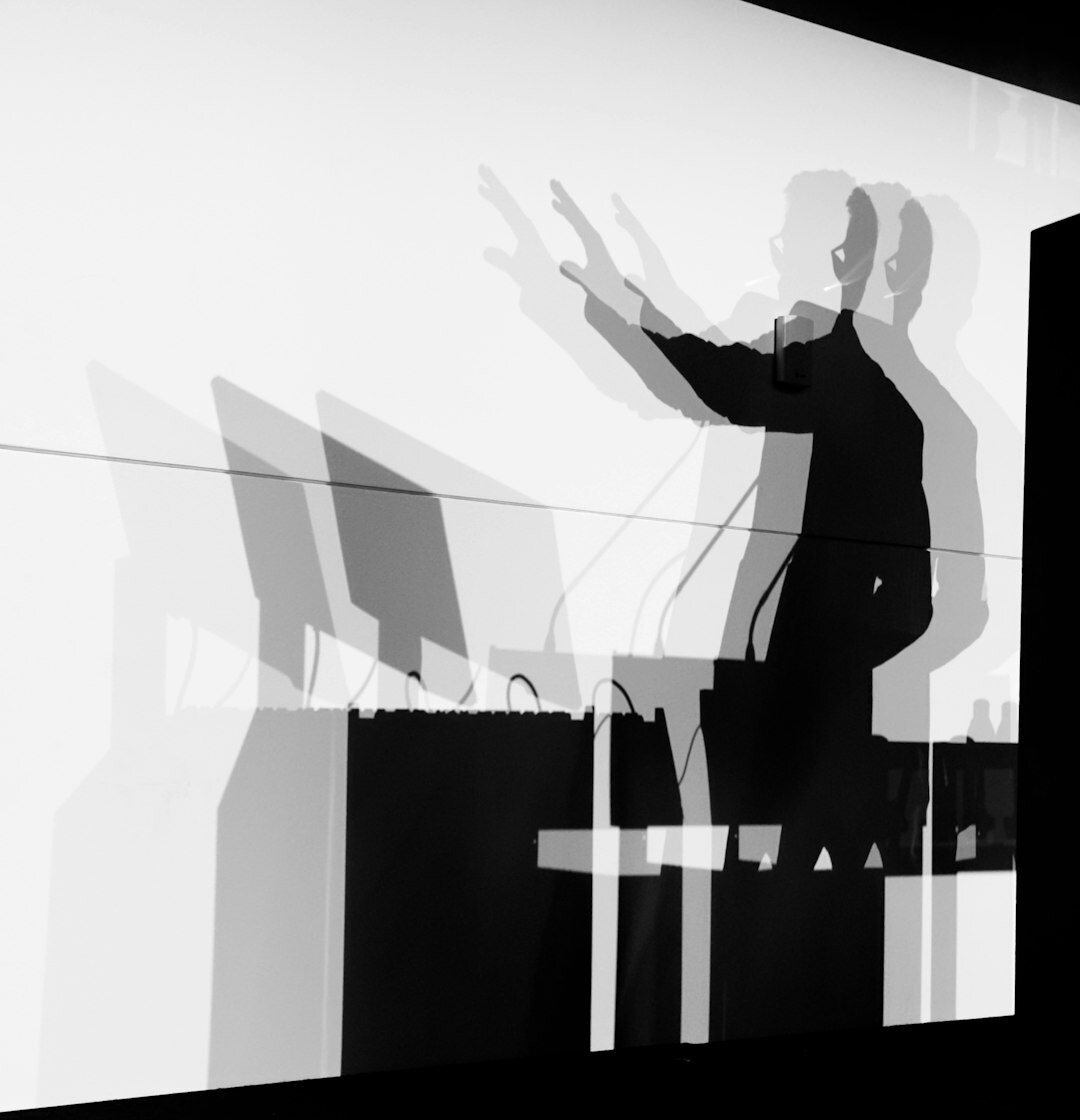Brazilian man practicing a speech alone in a room