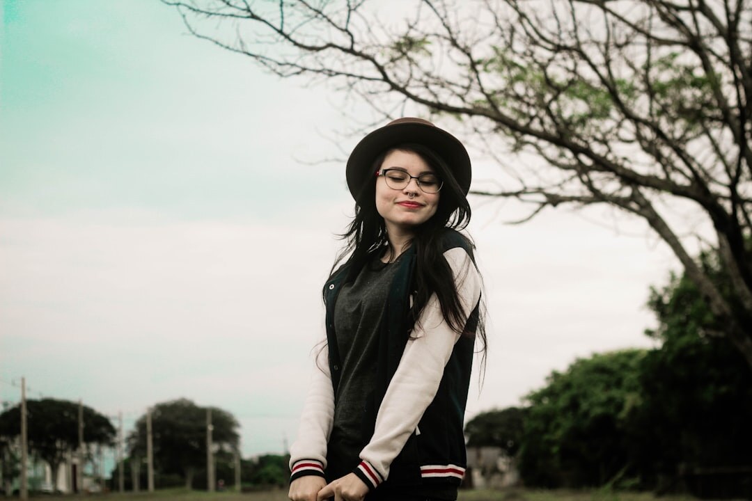 Confident Brazilian woman standing outdoors with arms relaxed
