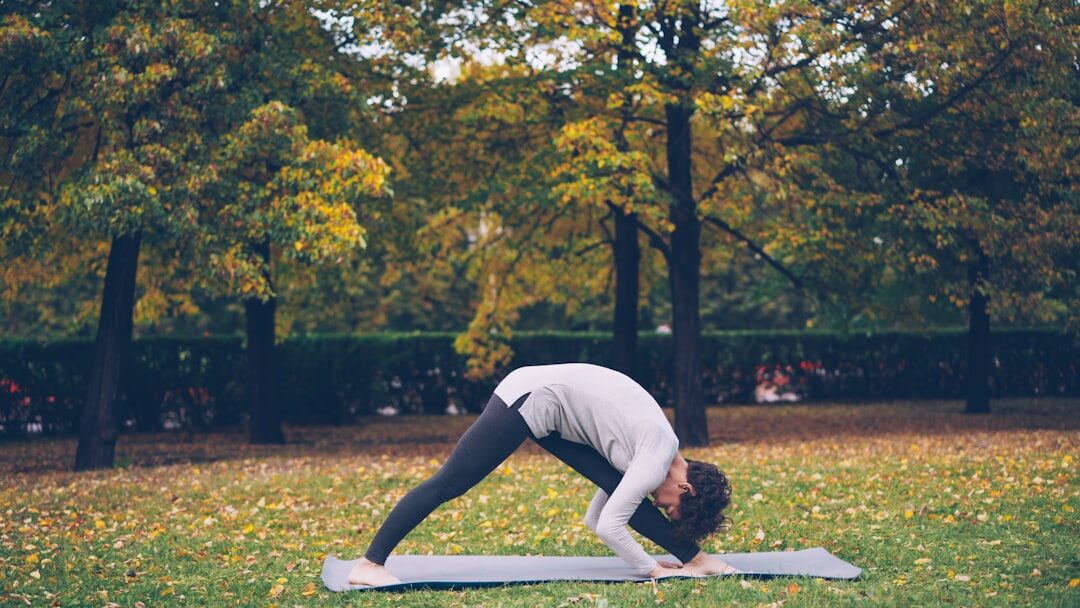 woman doing yoga in park