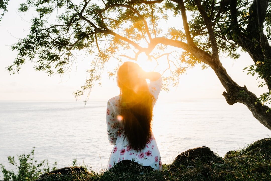 person meditating in nature